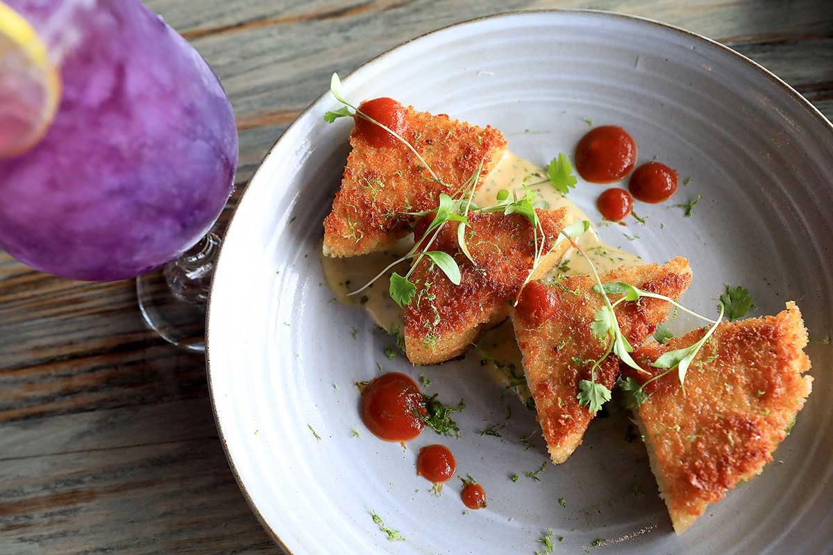 Casa Pearl’s shrimp toast with an April Showers cocktail in the Edge District.